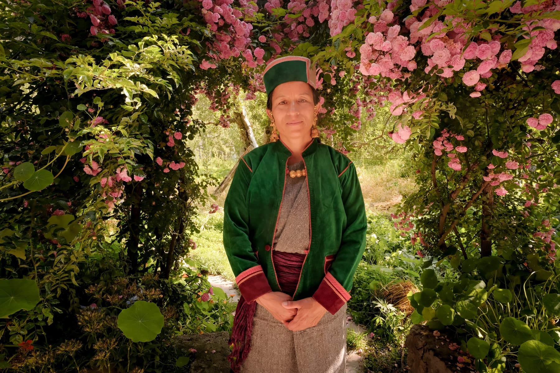 Traditional Kinnauri dress beneath the roses