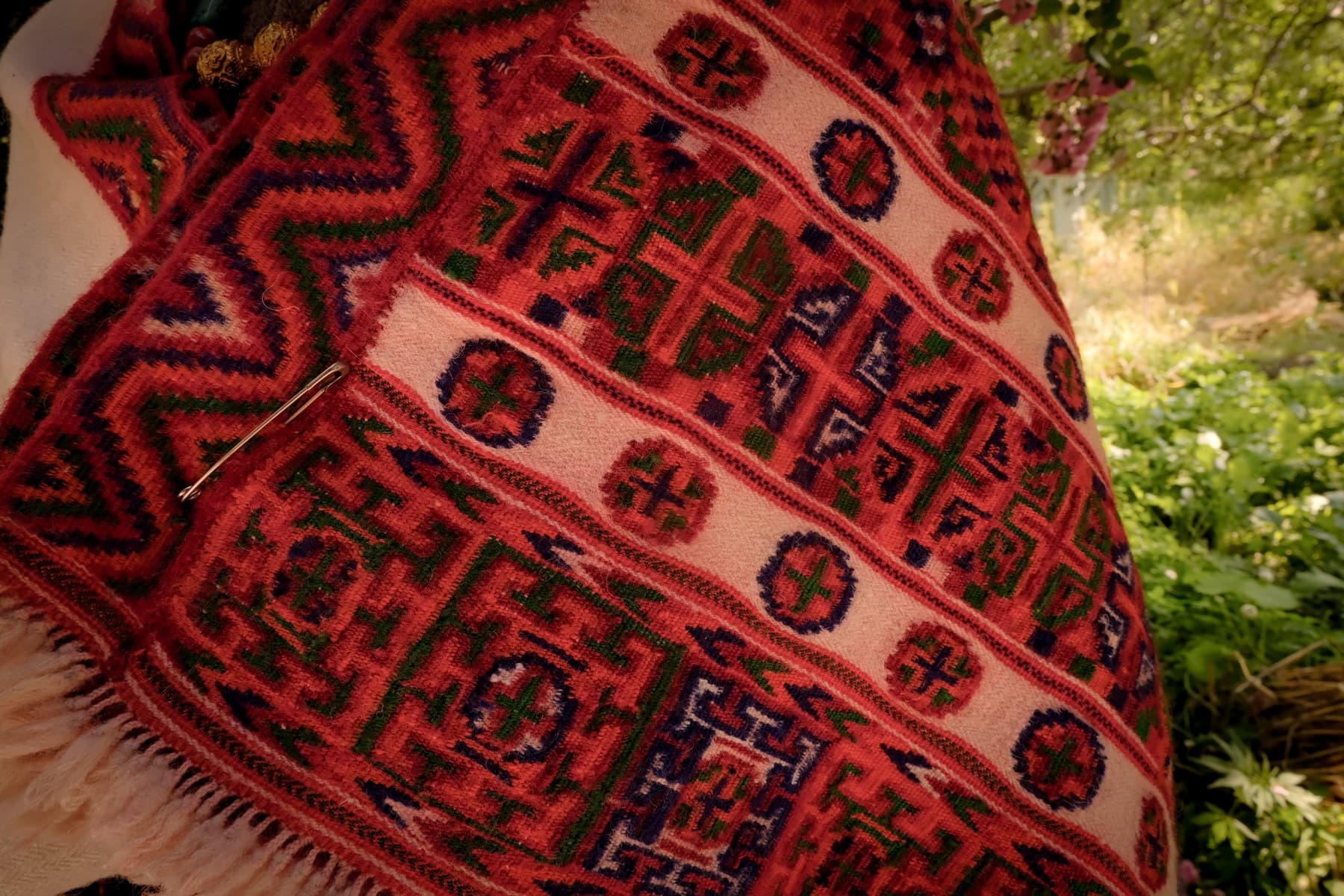 A hand-woven Kinnauri shawl in red, green and indigo